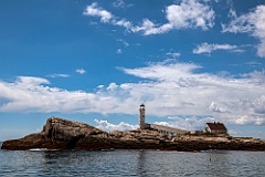 White Island Light on Rocky Terrain on a Sunny Day